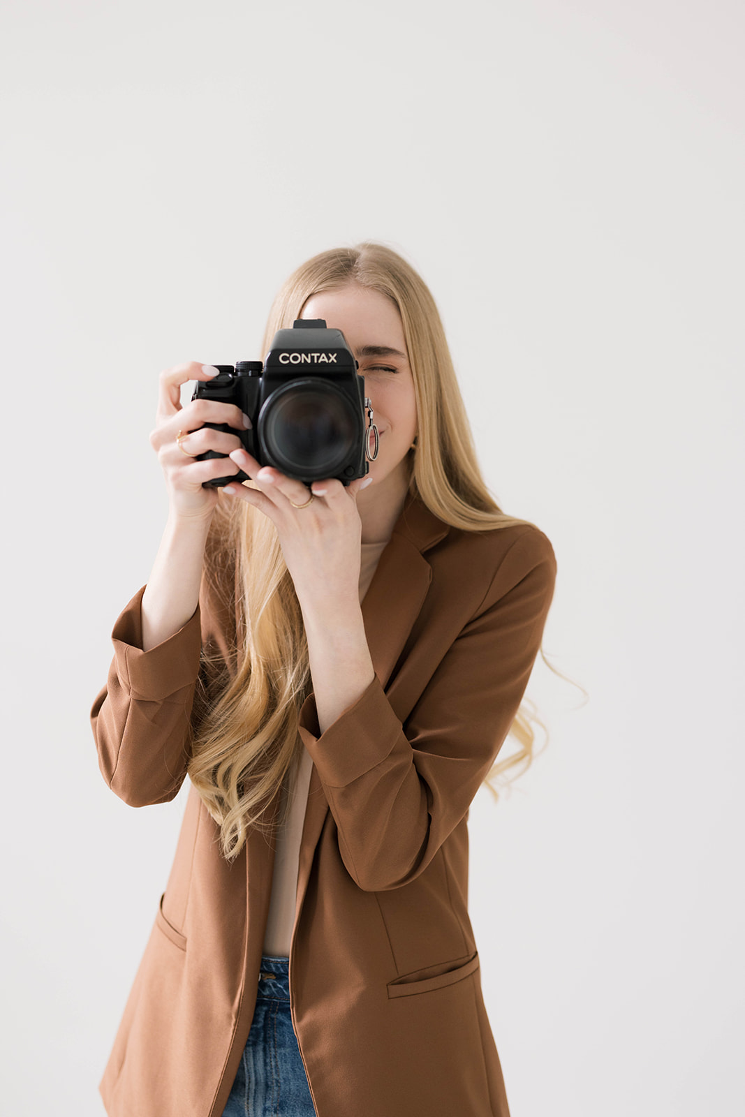 Kiley with Kiley Ann Photography posing fo r for a professional portrait for her wedding photography business based in Columbia, Missouri.