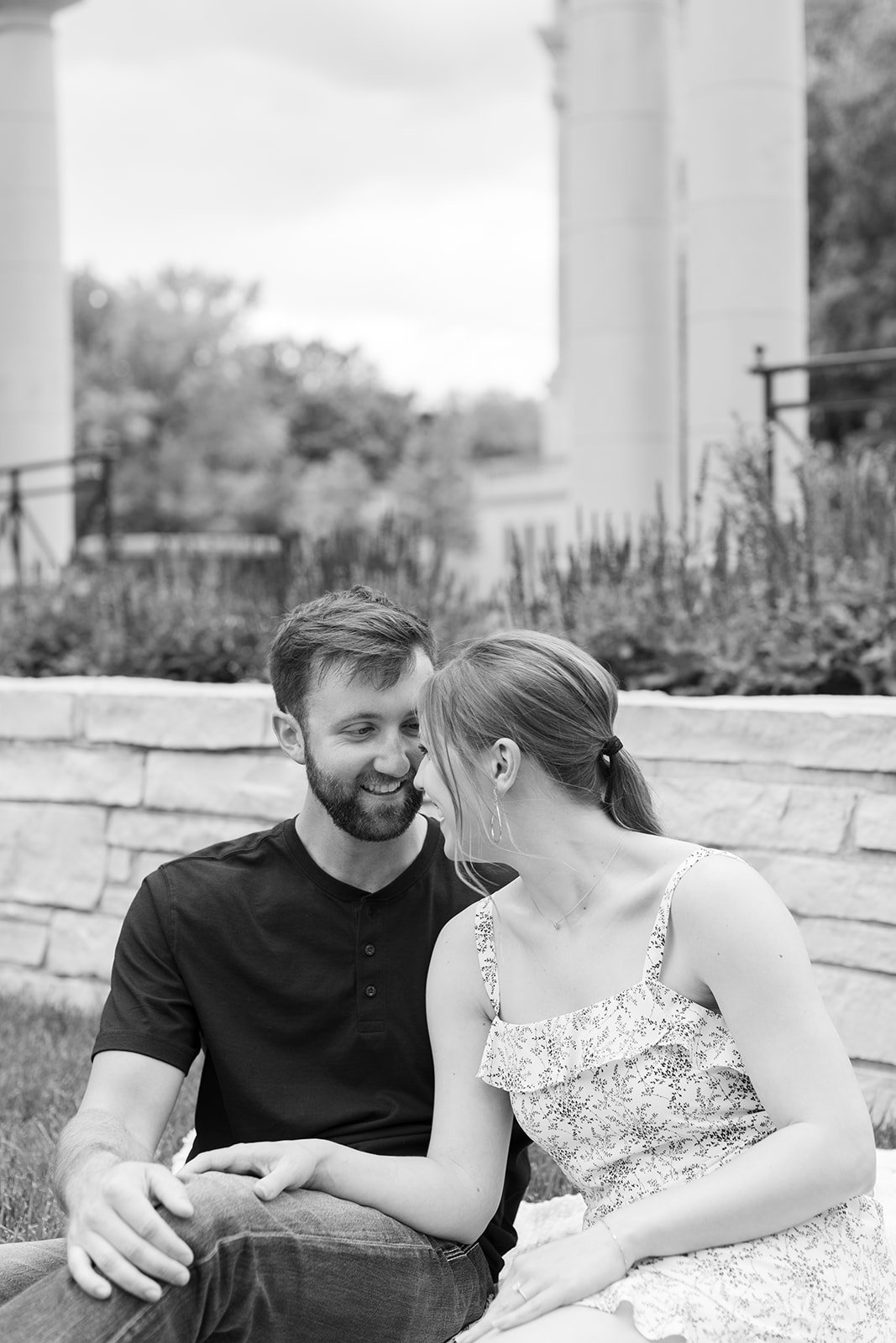 A couple laughing during their spring engagement session in Jefferson City Missouri